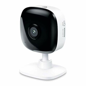 Compact indoor security camera on stand.