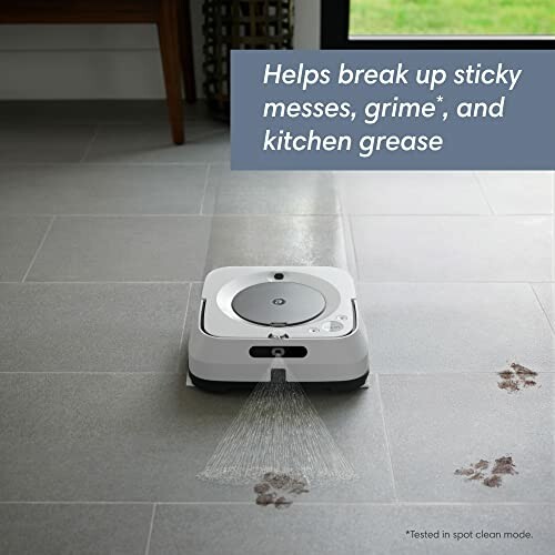 Robot mop cleaning floor with water spray and text about breaking up sticky messes.