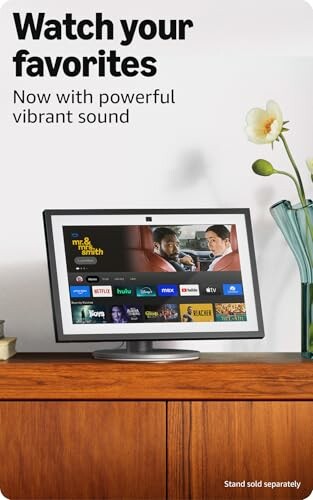 TV displaying streaming service interface on a wooden cabinet.