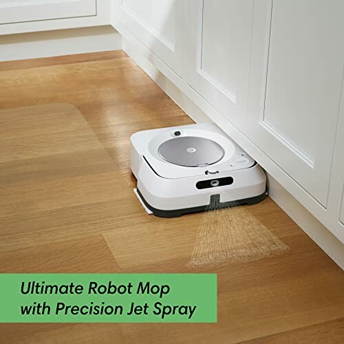 Robot mop cleaning a wooden floor with precision jet spray.